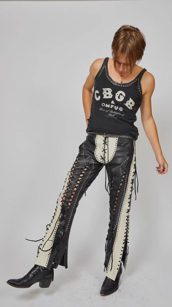 Leatheracci was founded by late designer Calvin Durham in 1960s. His technique was unique in that he uses little machine stitching, but instead constructed his garments using studding and lacing to build the form. Co-Founder Denise Fiacco, recalls "He was a vendor, and my husband and I wanted to help revive his brand."